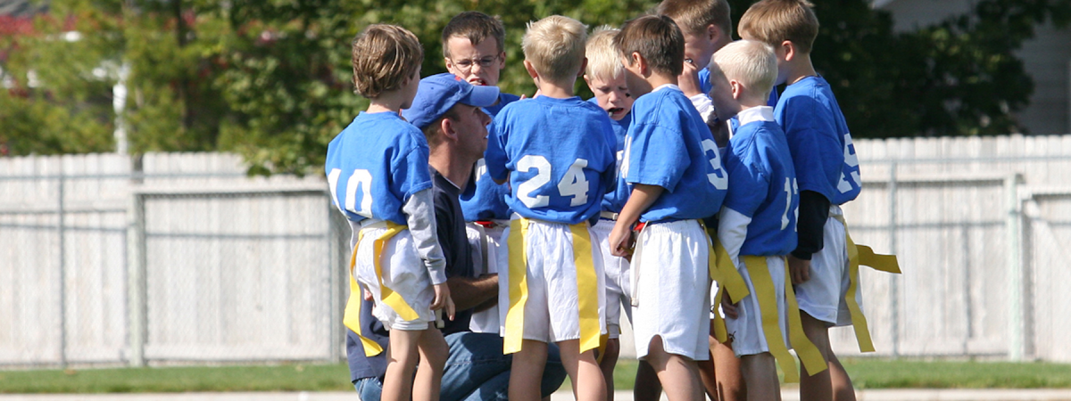Coaching a group of young flag football players